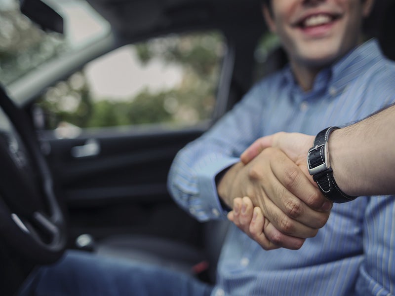 Diamond Ford in Lancaster CA Ford customer shaking hand with sales rep