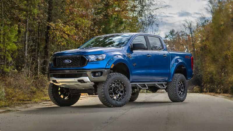 Black Widow Lifted Truck in blue side view